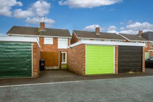 REAR GARAGE & PARKING SPACE- click for photo gallery